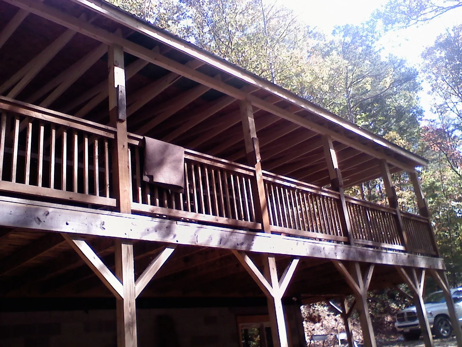 Timber framing under a new elevated porch and deck in Mounds